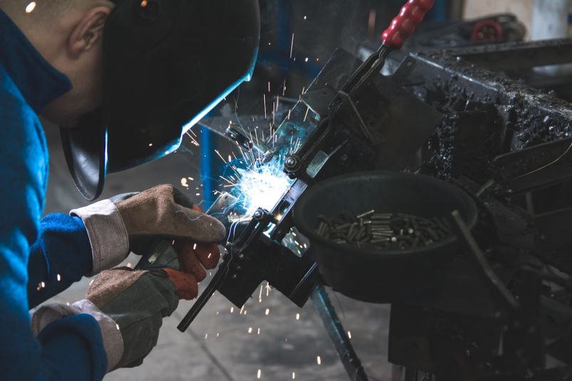 Welder hard work smoke sparks unsplash.com,  Daniel Wiadro